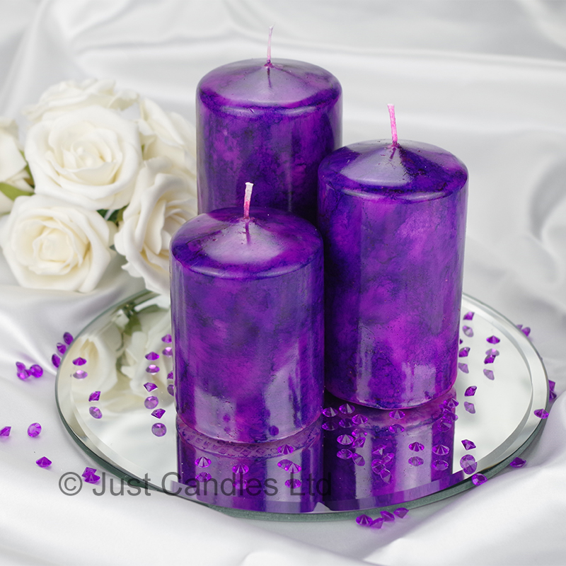 A Cadbury Purple coloured marble effect wedding centrepiece pillar
