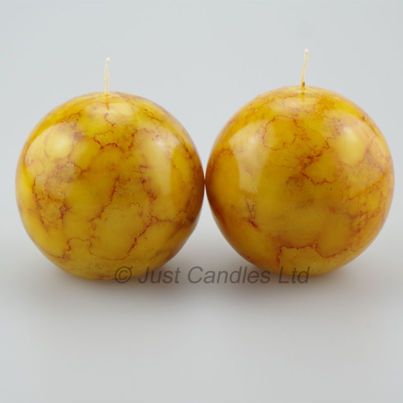 Mustard coloured marble effect ball candles Justcandles.co.uk