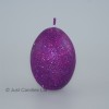 Egg shaped glittery plum candle