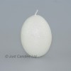 Egg shaped glittery white candle