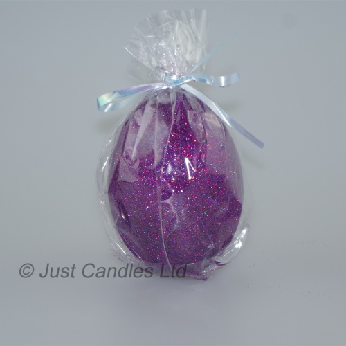 Egg shaped glittery plum candle