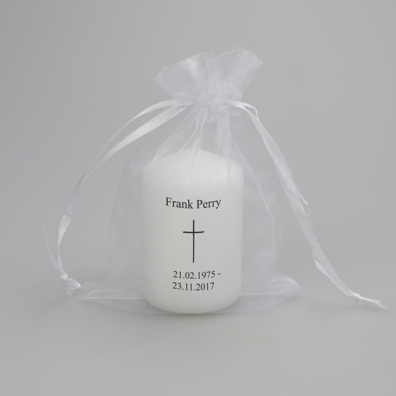 Small memorial candle with message and thin cross