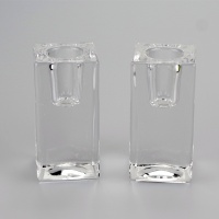 A pair of square glass taper candle holders